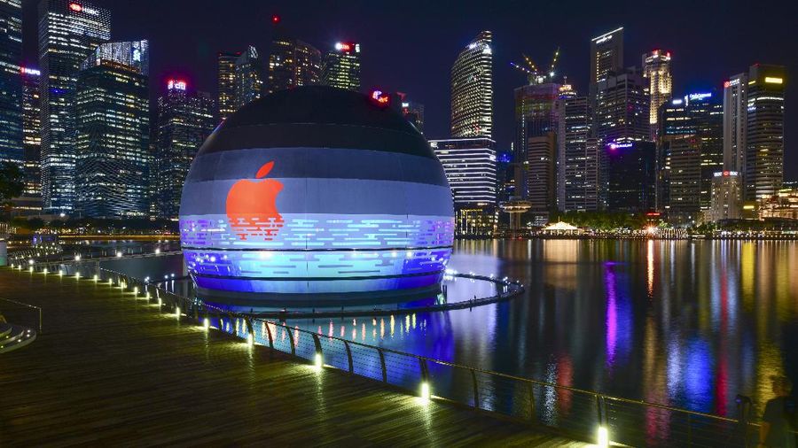 This picture taken on Monday, Aug. 24, 2020, shows Apple's third store in Singapore housed in a sphere floating on Marina Bay with the background of business district in Singapore. (Yeen Ling Chong via AP)