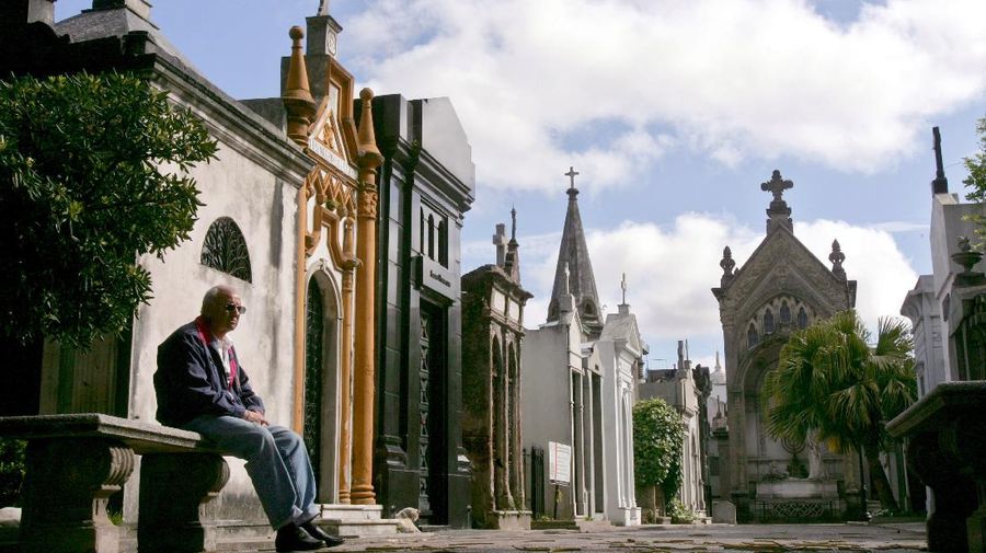 A man rests on a bench at the Recoleta cemetery in Buenos Aires, Argentina. The cemetery includes graves of some of the most influential people of Argentina, including several presidents, scientists and Eva Peron. (AP Photo/Natacha Pisarenko)