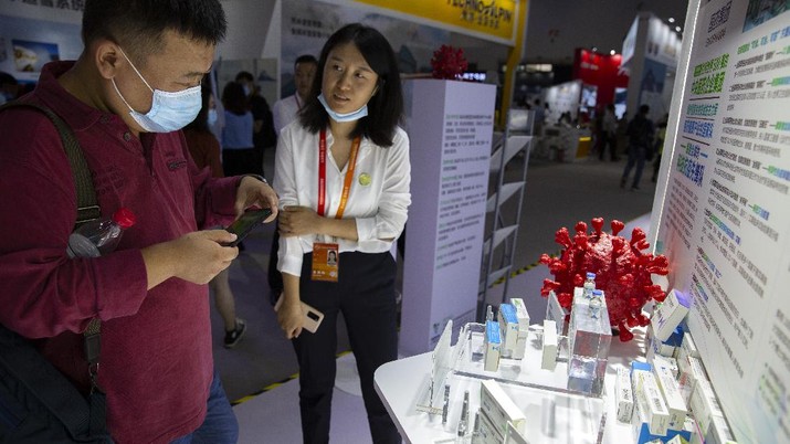 A box for a COVID-19 immunoglobin treatment is displayed at an exhibit by Chinese pharmaceutical firm Sinopharm at the China International Fair for Trade in Services (CIFTIS) in Beijing, Saturday, Sept. 5, 2020. With the COVID-19 pandemic largely under control, China's capital on Saturday kicked off one of the first large-scale public events since the start of the coronavirus outbreak, as tens of thousands of attendees were expected to visit displays from nearly 2,000 Chinese and foreign companies showcasing their products and services. (AP Photo/Mark Schiefelbein)