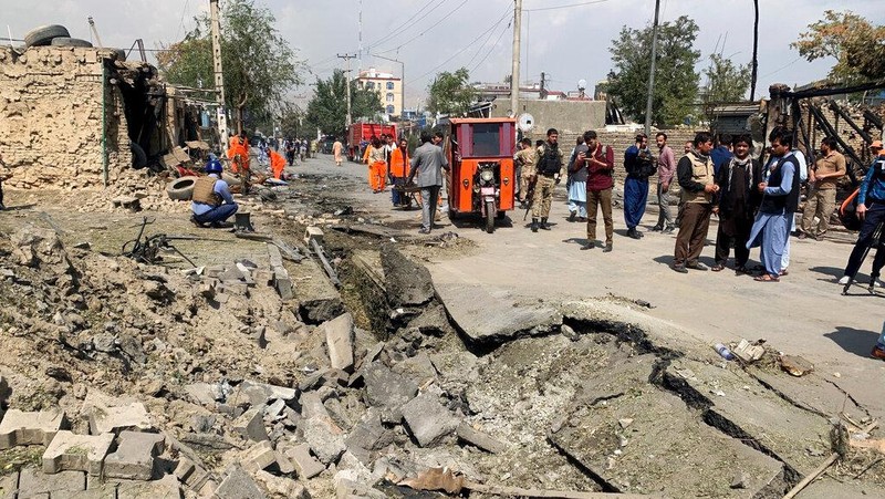 Afghan municipality workers clear debris at the site of an explosion in Kabul, Afghanistan, Wednesday, Sept. 9, 2020. Spokesman for Afghanistan's Interior Ministry said the bombing that targeted the convoy of the country's first vice president on Wednesday morning killed several people and wounded more than a dozen others, including several of the vice president's bodyguards. (AP Photo/Rahmat Gul)