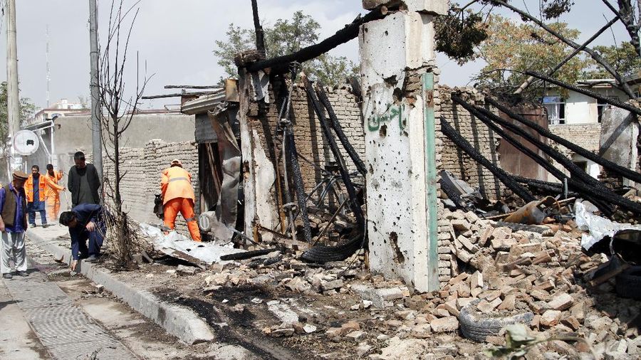 Afghan municipality workers clear debris at the site of an explosion in Kabul, Afghanistan, Wednesday, Sept. 9, 2020. Spokesman for Afghanistan's Interior Ministry said the bombing that targeted the convoy of the country's first vice president on Wednesday morning killed several people and wounded more than a dozen others, including several of the vice president's bodyguards. (AP Photo/Rahmat Gul)