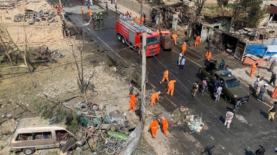 Afghan municipality workers clear debris at the site of an explosion in Kabul, Afghanistan, Wednesday, Sept. 9, 2020. Spokesman for Afghanistan's Interior Ministry said the bombing that targeted the convoy of the country's first vice president on Wednesday morning killed several people and wounded more than a dozen others, including several of the vice president's bodyguards. (AP Photo/Rahmat Gul)