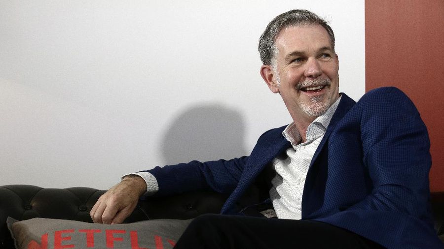 FILE - In this Feb. 28, 2017, file photo, Netflix Founder and CEO Reed Hastings smiles during an interview in Barcelona, Spain. Prominent charter school supporters are dishing out campaign money, as key gubernatorial races in several states have now begun in earnest. Hastings and philanthropist Laurene Powell Jobs donated $29,200 each, the maximum amount, to Democrat Gavin Newsom's campaign for California governor. (AP Photo/Manu Fernandez, File)