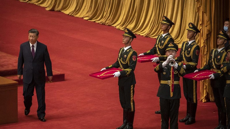 Attendees wearing face masks arrive for an event to honor some of those involved in China's fight against COVID-19 at the Great Hall of the People in Beijing, Tuesday, Sept. 8, 2020. Chinese leader Xi Jinping is praising China's role in battling the global coronavirus pandemic and expressing support for the U.N.'s World Health Organization, in a repudiation of U.S. criticism and a bid to rally domestic support for Communist Party leadership. (AP Photo/Mark Schiefelbein)