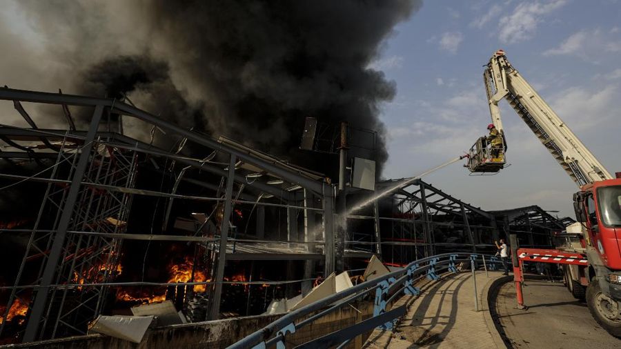 Firefighters work to extinguish a fire at warehouses at the seaport in Beirut, Lebanon, Thursday, Sept. 10. 2020. A huge fire broke out Thursday at the Port of Beirut, triggering panic among residents traumatized by last month's massive explosion that killed and injured thousands of people. (AP Photo/Hassan Ammar)
