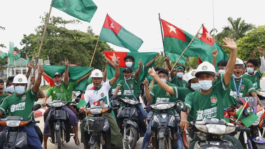 Supporters of Union Solidarity and Development Party (USDP) ride motorbikes displaying party flags during an election campaign in Naypyitaw, Myanmar on Wednesday, Sept. 9, 2020. Myanmar holds a general election on Nov. 8 and has started an election campaign period which may be disrupted due to a resurgence of the coronavirus. (AP Photo/Aung Shine Oo)