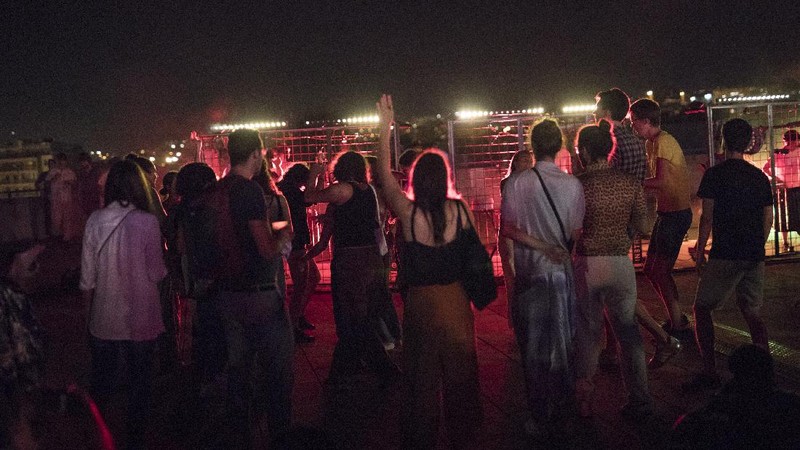People gather at a bar in Marseille, southern France, Saturday, Sept. 12, 2020. French Prime Minister Jean Castex warned that the virus situation is 