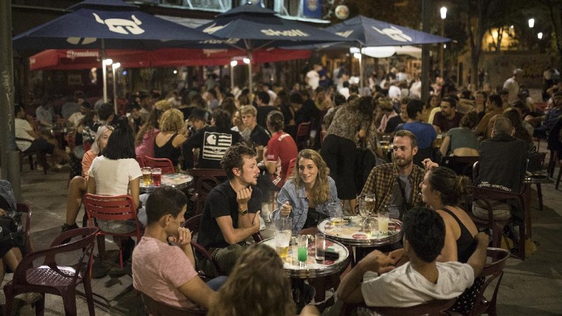 People gather at a bar in Marseille, southern France, Saturday, Sept. 12, 2020. French Prime Minister Jean Castex warned that the virus situation is 