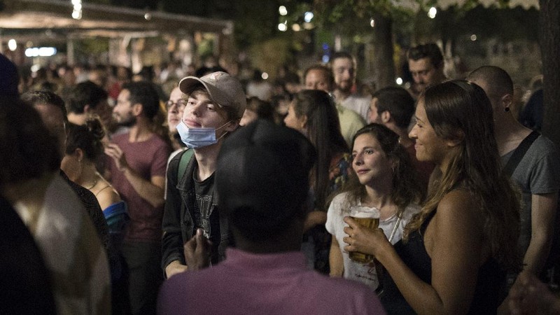 People gather at a bar in Marseille, southern France, Saturday, Sept. 12, 2020. French Prime Minister Jean Castex warned that the virus situation is 