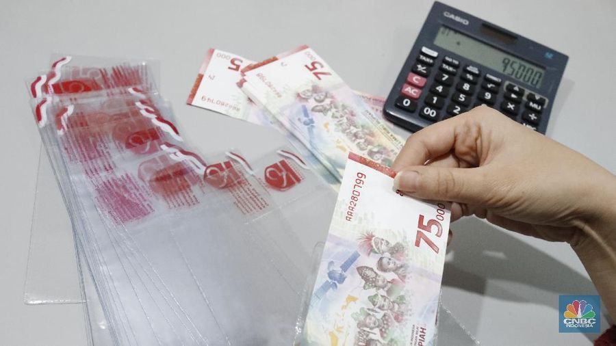 Ilustrasi pecahan uang 75.000. (CNBC Indonesia/Tri Susilo)