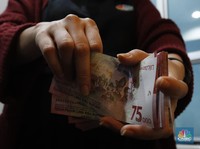Rupiah Lemah di Kurs Tengah BI, Tapi Menguat Pasar Spot