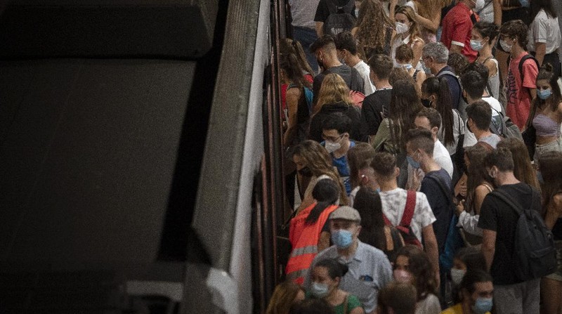 Pedestrians wearing face masks to prevent the spread of coronavirus walk in downtown Madrid, Spain, Thursday, Sept. 17, 2020. With a coronavirus caseload above 600,000 and more than 30,000 confirmed deaths, Spain has been the hardest hit European country in the second wave of the pandemic. (AP Photo/Bernat Armangue)