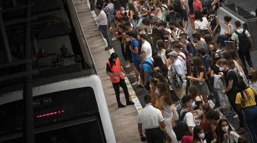 Pedestrians wearing face masks to prevent the spread of coronavirus walk in downtown Madrid, Spain, Thursday, Sept. 17, 2020. With a coronavirus caseload above 600,000 and more than 30,000 confirmed deaths, Spain has been the hardest hit European country in the second wave of the pandemic. (AP Photo/Bernat Armangue)