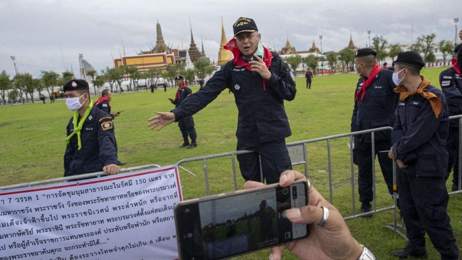 Pro-democracy demonstrators enter the Sanam Luang field, popular location for political protests, in Bangkok, Thailand, Saturday, Sept. 19, 2020. Protesters gathered Saturday in Bangkok for what was expected to be the biggest rally yet in an ongoing campaign calling for a new election and democratic reforms. (AP Photo/Gemunu Amarasinghe)