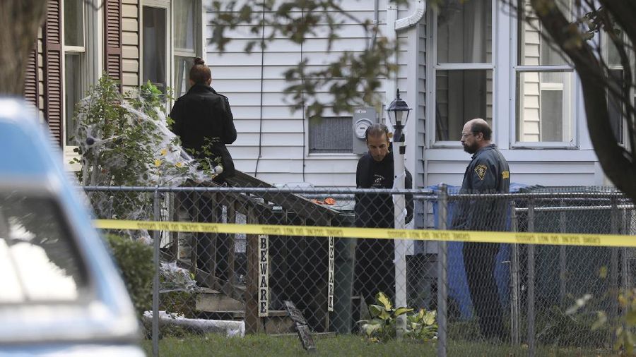 Police respond to the scene of a shooting early Saturday, Sept. 19, 2020 in Rochester, N.Y.  As many as 100 people were at a backyard party when the shooting started just before 12:30 a.m., Acting Police Chief Mark Simmons told reporters.  (13 WHAM via AP)