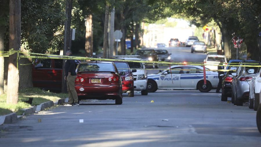 Police respond to the scene of a shooting early Saturday, Sept. 19, 2020 in Rochester, N.Y.  As many as 100 people were at a backyard party when the shooting started just before 12:30 a.m., Acting Police Chief Mark Simmons told reporters.  (13 WHAM via AP)