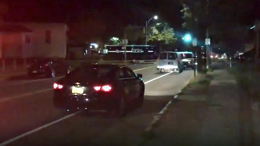 Police respond to the scene of a shooting early Saturday, Sept. 19, 2020 in Rochester, N.Y.  As many as 100 people were at a backyard party when the shooting started just before 12:30 a.m., Acting Police Chief Mark Simmons told reporters.  (13 WHAM via AP)