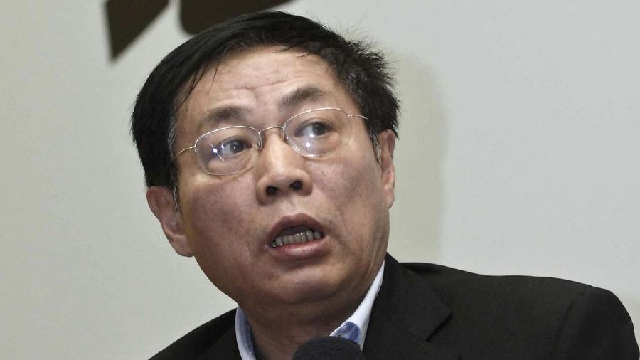 FILE - In this Nov. 12, 2010, file photo, Chinese real estate mogul Ren Zhiqiang speaks at a press reception for his book on China's property market in Shanghai. Ren, who publicly criticized President Xi Jinping’s handling of the coronavirus pandemic was sentenced to 18 years in prison on Tuesday, Sept. 22, 2020, in a corruption case, the government announced. (Chinatopix via AP, File)