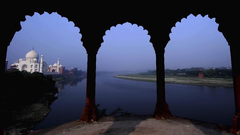 A paramilitary soldier wearing a mask stands guard as the Taj Mahal monument is reopened after being closed for more than six months due to the coronavirus pandemic in Agra, India, Monday, Sept.21, 2020. (AP Photo/Pawan Sharma)