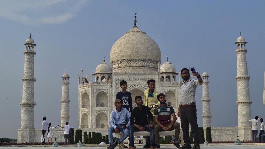 A paramilitary soldier wearing a mask stands guard as the Taj Mahal monument is reopened after being closed for more than six months due to the coronavirus pandemic in Agra, India, Monday, Sept.21, 2020. (AP Photo/Pawan Sharma)