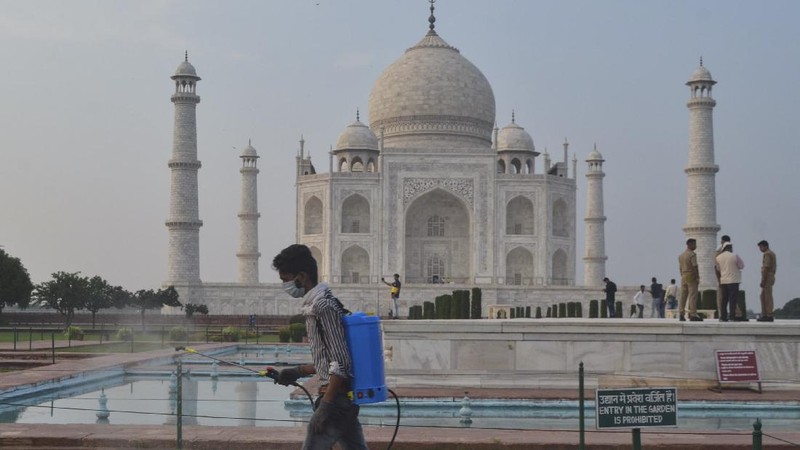 A paramilitary soldier wearing a mask stands guard as the Taj Mahal monument is reopened after being closed for more than six months due to the coronavirus pandemic in Agra, India, Monday, Sept.21, 2020. (AP Photo/Pawan Sharma)