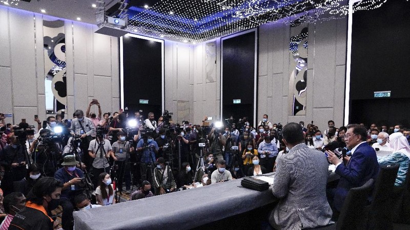Malaysia's opposition leader Anwar Ibrahim gestures as he leaves after a press conference in Kuala Lumpur, Wednesday, Sept. 23, 2020. Anwar said he has secured a majority in parliament to form a new government that is “strong, stable and formidable.