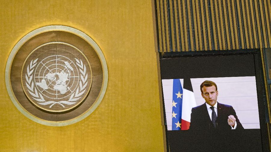 In this photo provided by the United Nations, the French President Emmanuel Macron's pre-recorded message is played during the 75th session of the United Nations General Assembly, Tuesday, Sept. 22, 2020, at U.N. headquarters in New York. The U.N.'s first virtual meeting of world leaders started Tuesday with pre-recorded speeches from some of the planet's biggest powers, kept at home by the coronavirus pandemic that will likely be a dominant theme at their video gathering this year. (Rick Bajornas/UN Photo via AP)