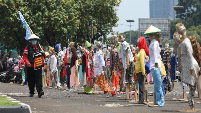Sejumlah elemen dari aktivis hingga mahasiswa melakukan aksi demo dalam rangka Hari Tani Nasional. (CNBC Indonesia/Andrean Kristianto)
