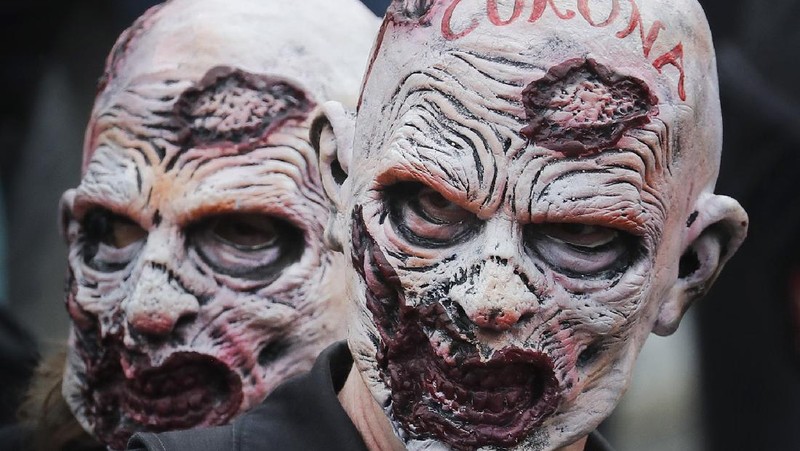 People take part in a 'We Do Not Consent' rally at Trafalgar Square, organised by Stop New Normal, to protest against coronavirus restrictions, in London, Saturday, Sept. 26, 2020. (Stefan Rousseau/PA via AP)