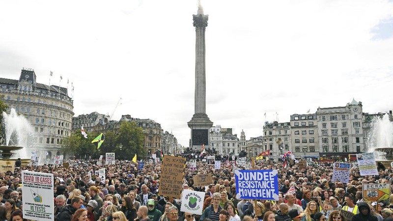People take part in a 'We Do Not Consent' rally at Trafalgar Square, organised by Stop New Normal, to protest against coronavirus restrictions, in London, Saturday, Sept. 26, 2020. (Stefan Rousseau/PA via AP)