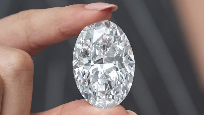 A 102.39 carat, D color, flawless diamond is displayed by a model at a Sotheby’s auction room in Hong Kong Monday, Sept. 28, 2020. It is the first time that a diamond this size and caliber will be actioned without reservations in history. (AP Photo/Vincent Yu)