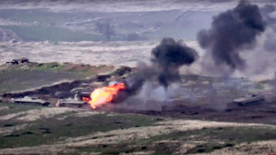 In this handout photo taken from a footage released by Azerbaijan's Defense Ministry on Sunday, Sept. 27, 2020, Azerbaijan's forces destroy Armenian anti-aircraft system at the contact line of the self-proclaimed Republic of Nagorno-Karabakh, Azerbaijan. Fighting between Armenia and Azerbaijan broke out Sunday around the separatist region of Nagorno-Karabakh and the Armenian Defense Ministry said two Azerbaijani helicopters were shot down. Azerbaijan's President Ilham Aliyev said in a televised address to the nation that 