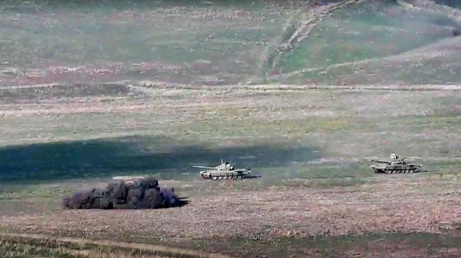 In this handout photo taken from a footage released by Azerbaijan's Defense Ministry on Sunday, Sept. 27, 2020, Azerbaijan's forces destroy Armenian anti-aircraft system at the contact line of the self-proclaimed Republic of Nagorno-Karabakh, Azerbaijan. Fighting between Armenia and Azerbaijan broke out Sunday around the separatist region of Nagorno-Karabakh and the Armenian Defense Ministry said two Azerbaijani helicopters were shot down. Azerbaijan's President Ilham Aliyev said in a televised address to the nation that 