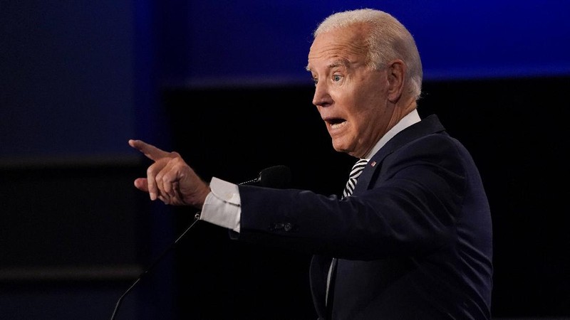 Democratic presidential candidate former Vice President Joe Biden gestures as President Donald Trump walks onto stage for the first presidential debate Tuesday, Sept. 29, 2020, at Case Western University and Cleveland Clinic, in Cleveland. (Olivier Douliery/Pool vi AP)
