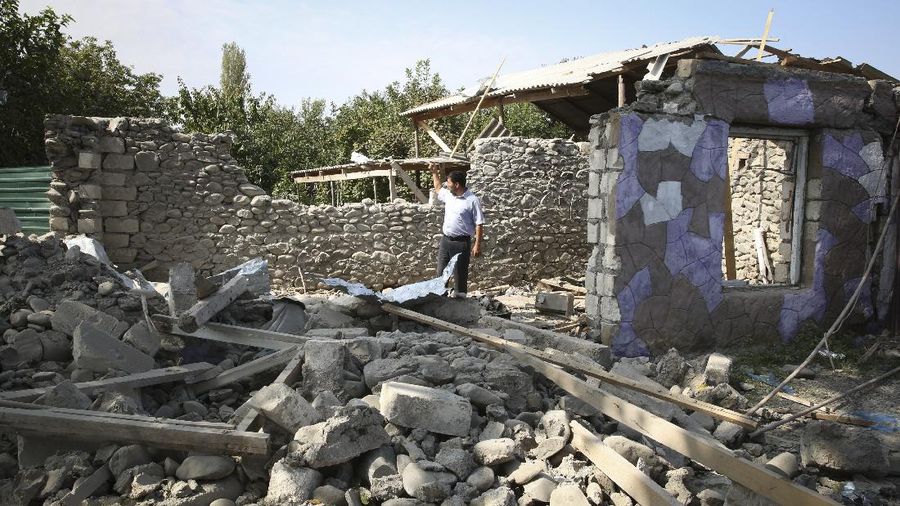 An Armenian serviceman fires a cannon towards Azerbaijan positions in the self-proclaimed Republic of Nagorno-Karabakh, Azerbaijan, Tuesday, Sept. 29, 2020. Armenian and Azerbaijani forces accused each other of attacks on their territory Tuesday, as fighting over the separatist region of Nagorno-Karabakh continued for a third straight day following the reigniting of a decades-old conflict. (Sipan Gyulumyan/Armenian Defense Ministry Press Service/PAN Photo via AP)