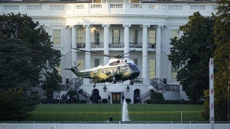 President Donald Trump waves as he leaves the White House to go to Walter Reed National Military Medical Center after he tested positive for COVID-19, Friday, Oct. 2, 2020, in Washington. (AP Photo/Alex Brandon)