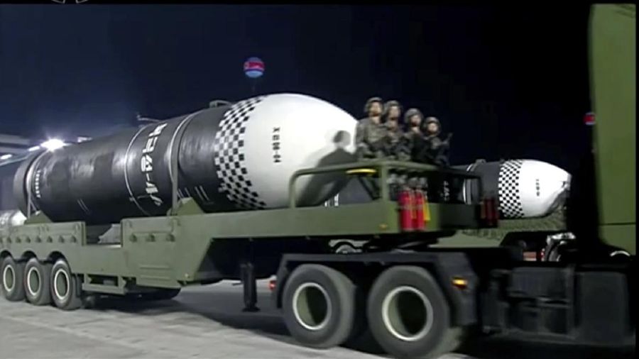 This image made from video broadcasted by North Korea's KRT, shows a military parade with what appears to be a possible new solid-fuel missile at the Kim Il Sung Square in Pyongyang, Saturday, Oct. 10, 2020. North Korean leader Kim Jong Un warned Saturday that his country would “fully mobilize” its nuclear force if threatened as he took center stage at a massive military parade to mark the 75th anniversary of the country’s ruling party. (KRT via AP)