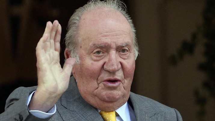 FILE - In this March 10, 2018 file photo, Spain's former monarch King Juan Carlos waves upon his arrival to the Academia Diplomatica de Chile, in Santiago. Spain’s prime minister says that he is “disturbed” by the financial scandal surrounding former King Juan Carlos I that is being investigated both in Spain and Switzerland. Pedro Sanchez said Wednesday, July 8, 2020 that “We are witnesses to unsettling revelations that have disturbed all of us.
