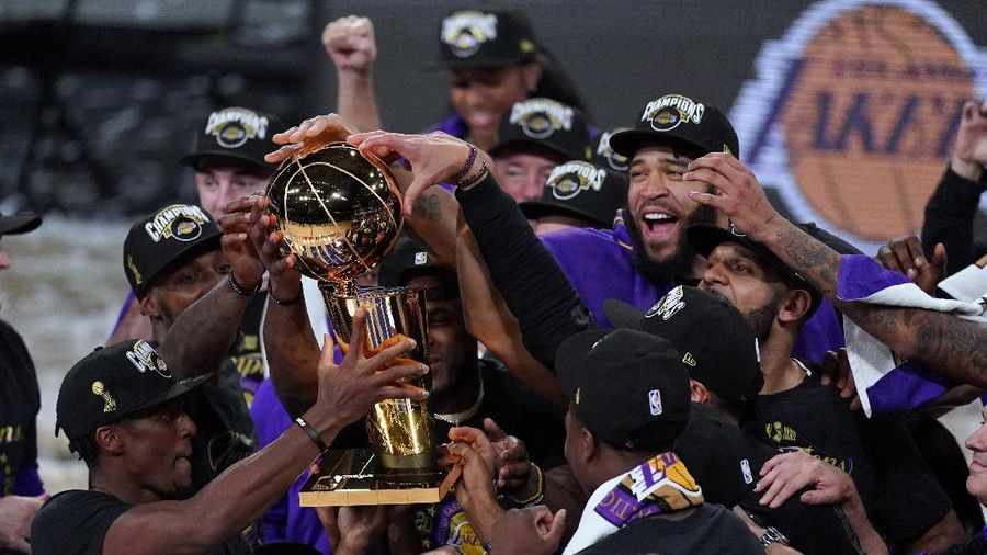 The Los Angeles Lakers players celebrate after the Lakers defeated the Miami Heat 103-88 in Game 6 of basketball's NBA Finals Sunday, Oct. 11, 2020, in Lake Buena Vista, Fla. (AP Photo/Mark J. Terrill)