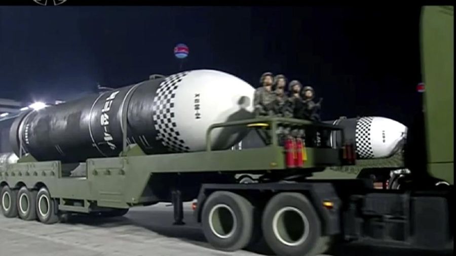 This image made from video broadcasted by North Korea's KRT, shows a military parade with what appears to be a possible new solid-fuel missile at the Kim Il Sung Square in Pyongyang, Saturday, Oct. 10, 2020. North Korean leader Kim Jong Un warned Saturday that his country would “fully mobilize” its nuclear force if threatened as he took center stage at a massive military parade to mark the 75th anniversary of the country’s ruling party. (KRT via AP)