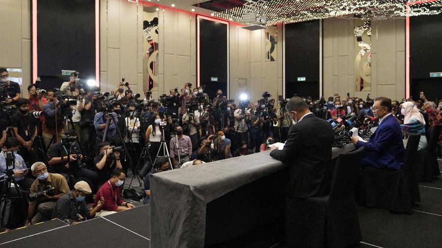 Malaysian opposition leader Anwar Ibrahim speaks during a press conference after meeting the nation's king in Kuala Lumpur, Malaysia, Tuesday, Oct. 13, 2020. Anwar met the king Tuesday in a bid to form a new government after claiming he had secured a majority in Parliament. (AP Photo/Vincent Thian)