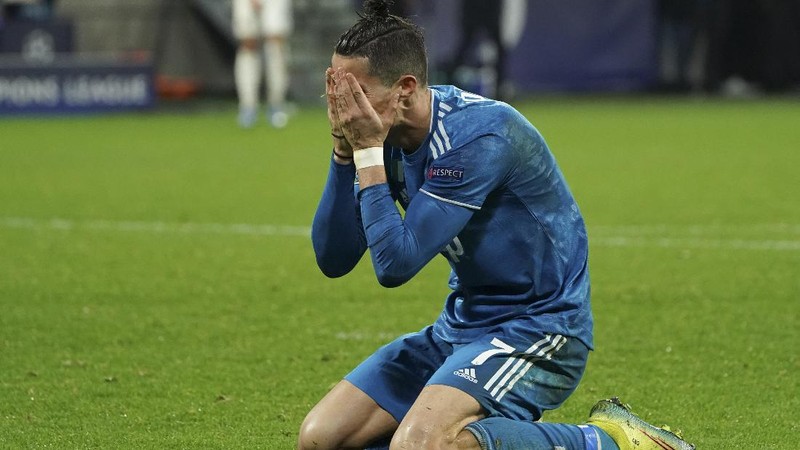 FILE - In this Wednesday, Feb. 26, 2020 file photo Juventus' Cristiano Ronaldo reacts after not being awarded a penalty shot during a round of sixteen, first leg, soccer match between Lyon and Juventus at the at the Lyon Olympic Stadium in Decines, outside Lyon, France. The Portuguese soccer federation says Cristiano Ronaldo has tested positive for the coronavirus. The federation says Ronaldo is doing well and has no symptoms. He has been dropped from the country's Nations League match against Sweden on Wednesday. (AP Photo/Laurent Cipriani, File)