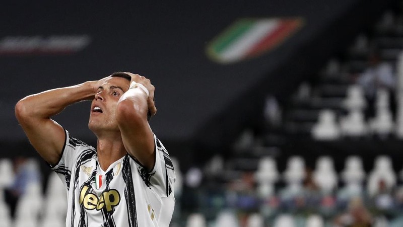 FILE - In this Friday, Aug. 7, 2020 file photo Juventus' Cristiano Ronaldo reacts during the Champions League round of 16 second leg, soccer match between Juventus and Lyon at the Allianz stadium in Turin, Italy. The Portuguese soccer federation says Cristiano Ronaldo has tested positive for the coronavirus. The federation says Ronaldo is doing well and has no symptoms. He has been dropped from the country's Nations League match against Sweden on Wednesday. (AP Photo/Antonio Calanni, File)