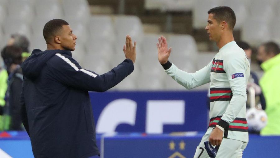 FILE - In this Wednesday, Feb. 26, 2020 file photo Juventus' Cristiano Ronaldo reacts after not being awarded a penalty shot during a round of sixteen, first leg, soccer match between Lyon and Juventus at the at the Lyon Olympic Stadium in Decines, outside Lyon, France. The Portuguese soccer federation says Cristiano Ronaldo has tested positive for the coronavirus. The federation says Ronaldo is doing well and has no symptoms. He has been dropped from the country's Nations League match against Sweden on Wednesday. (AP Photo/Laurent Cipriani, File)