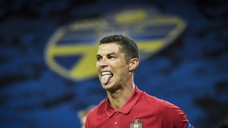FILE - In this Wednesday, Feb. 26, 2020 file photo Juventus' Cristiano Ronaldo reacts after not being awarded a penalty shot during a round of sixteen, first leg, soccer match between Lyon and Juventus at the at the Lyon Olympic Stadium in Decines, outside Lyon, France. The Portuguese soccer federation says Cristiano Ronaldo has tested positive for the coronavirus. The federation says Ronaldo is doing well and has no symptoms. He has been dropped from the country's Nations League match against Sweden on Wednesday. (AP Photo/Laurent Cipriani, File)