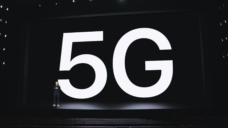 This image provided by Apple shows Apple CEO Tim Cook making a presentation on 5G and the new iPhone 12, which was unveiled Tuesday, Oct. 13, 2020. A much-hyped network upgrade called “5G” means different things to different people. To industry proponents, it’s the next huge innovation in wireless internet. To the U.S. government, it’s the backbone technology of a future that America will wrestle with China to control. To many average people, it’s simply a mystery. (Apple via AP)