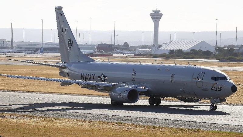 A U.S. Navy P-8 Poseidon takes off from Perth Airport, Australia, en route to rejoin ongoing search operations for the missing Malaysia Airlines Flight 370, Saturday, April 12, 2014. With no new underwater signals detected, Australian Prime Minister Tony Abbott said Saturday that the massive search for the Malaysian jet would likely continue 