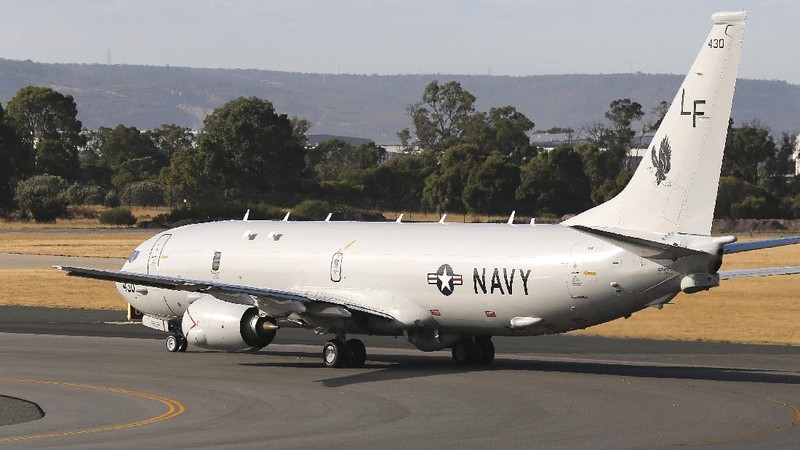 A U.S. Navy P-8 Poseidon takes off from Perth Airport, Australia, en route to rejoin ongoing search operations for the missing Malaysia Airlines Flight 370, Saturday, April 12, 2014. With no new underwater signals detected, Australian Prime Minister Tony Abbott said Saturday that the massive search for the Malaysian jet would likely continue 