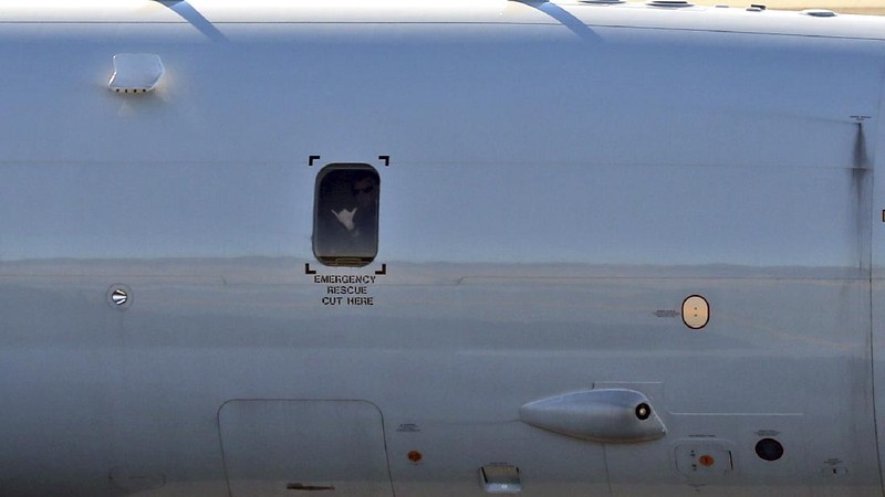 A U.S. Navy P-8 Poseidon takes off from Perth Airport, Australia, en route to rejoin ongoing search operations for the missing Malaysia Airlines Flight 370, Saturday, April 12, 2014. With no new underwater signals detected, Australian Prime Minister Tony Abbott said Saturday that the massive search for the Malaysian jet would likely continue 