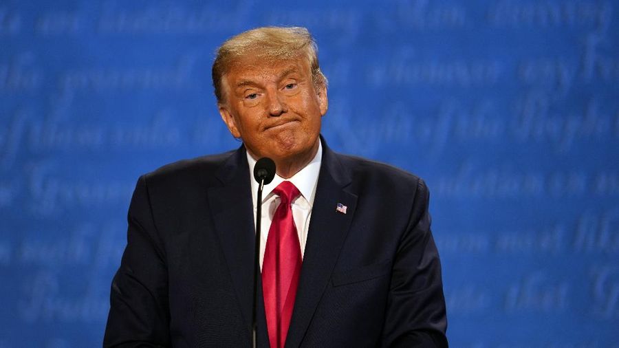 President Donald Trump listens during the second and final presidential debate Thursday, Oct. 22, 2020, at Belmont University in Nashville, Tenn., with Democratic presidential candidate former Vice President Joe Biden. (AP Photo/Julio Cortez)